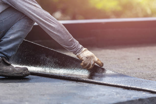 Professional Basement Waterproofing technician working in Bascom, OH